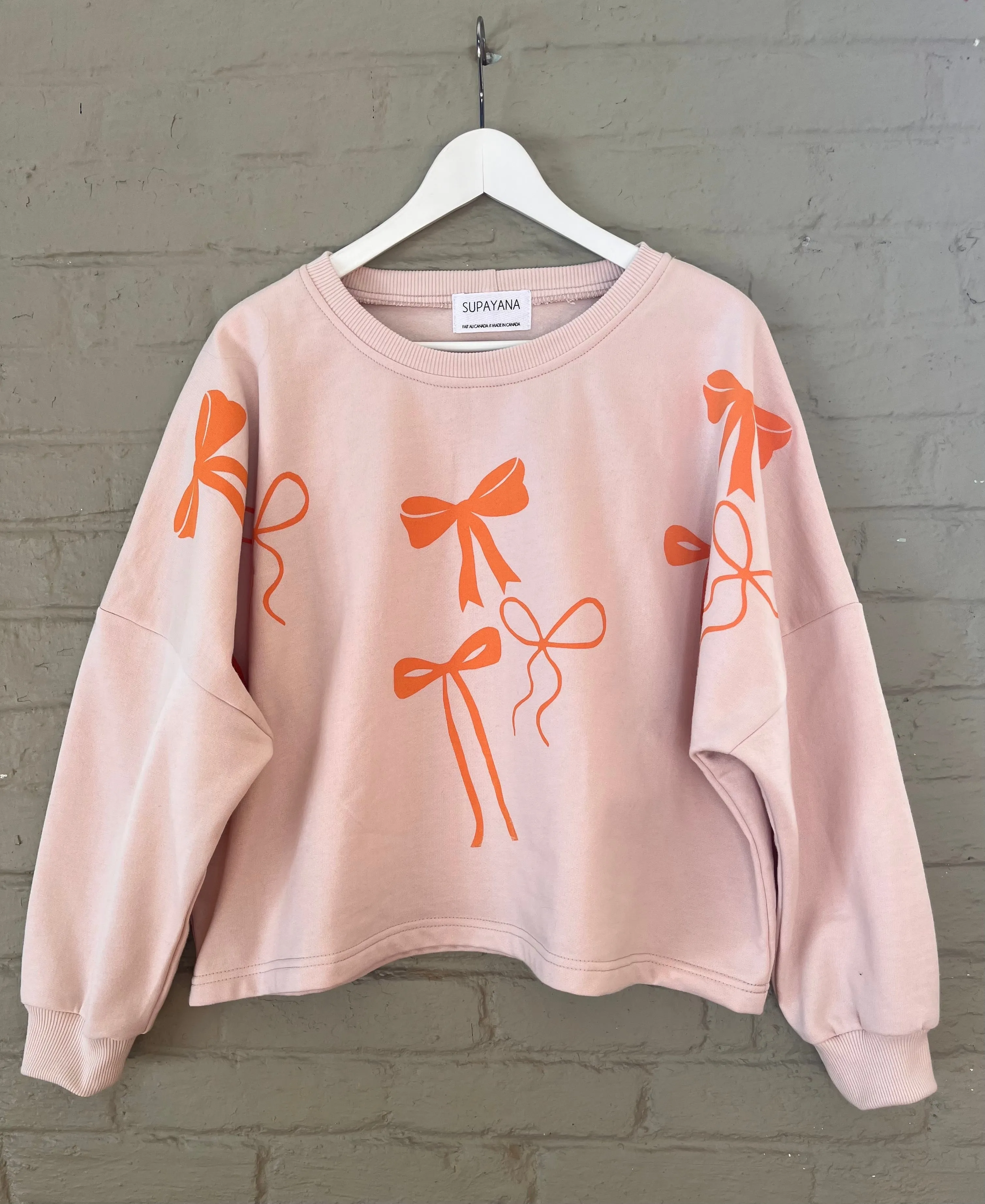 Organic cotton bow sweatshirt- size 1 (fits small through xl )