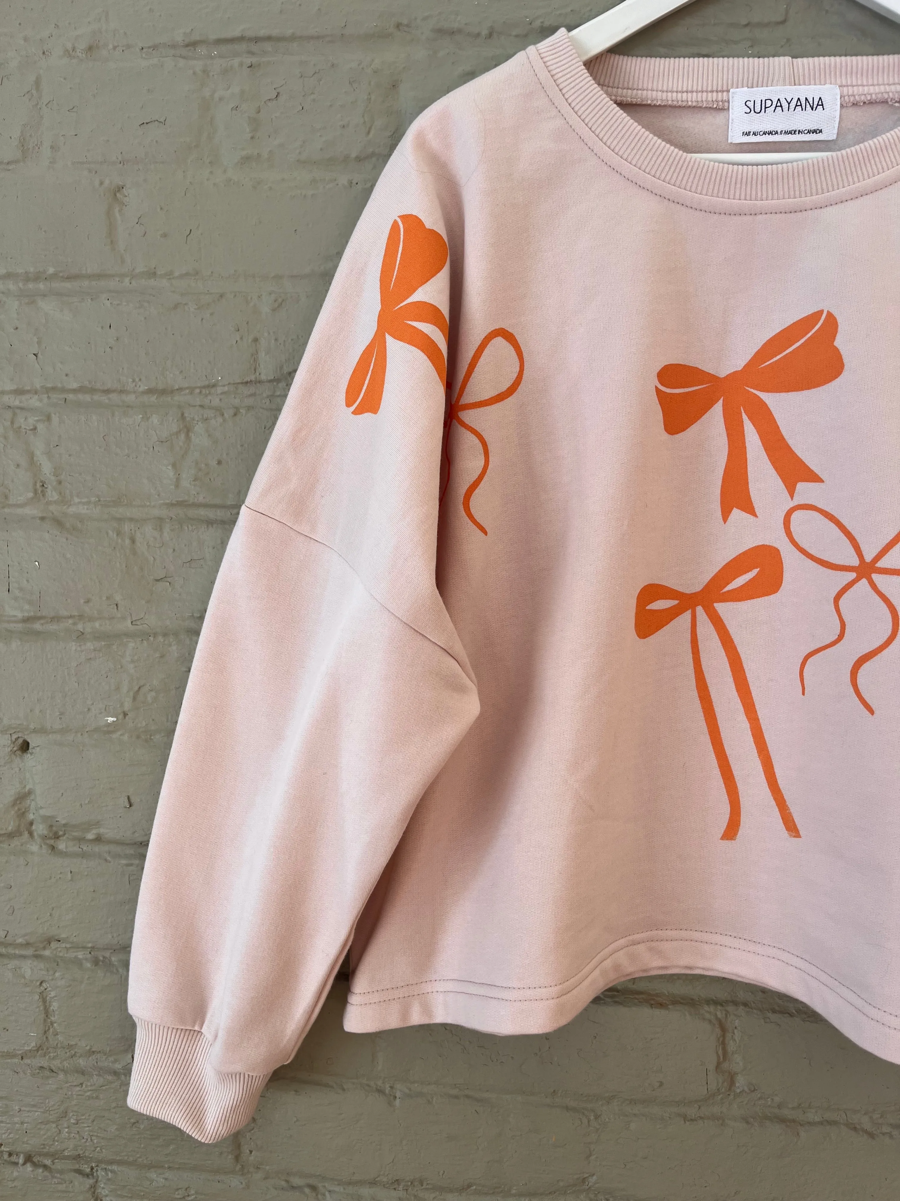 Organic cotton bow sweatshirt- size 1 (fits small through xl )