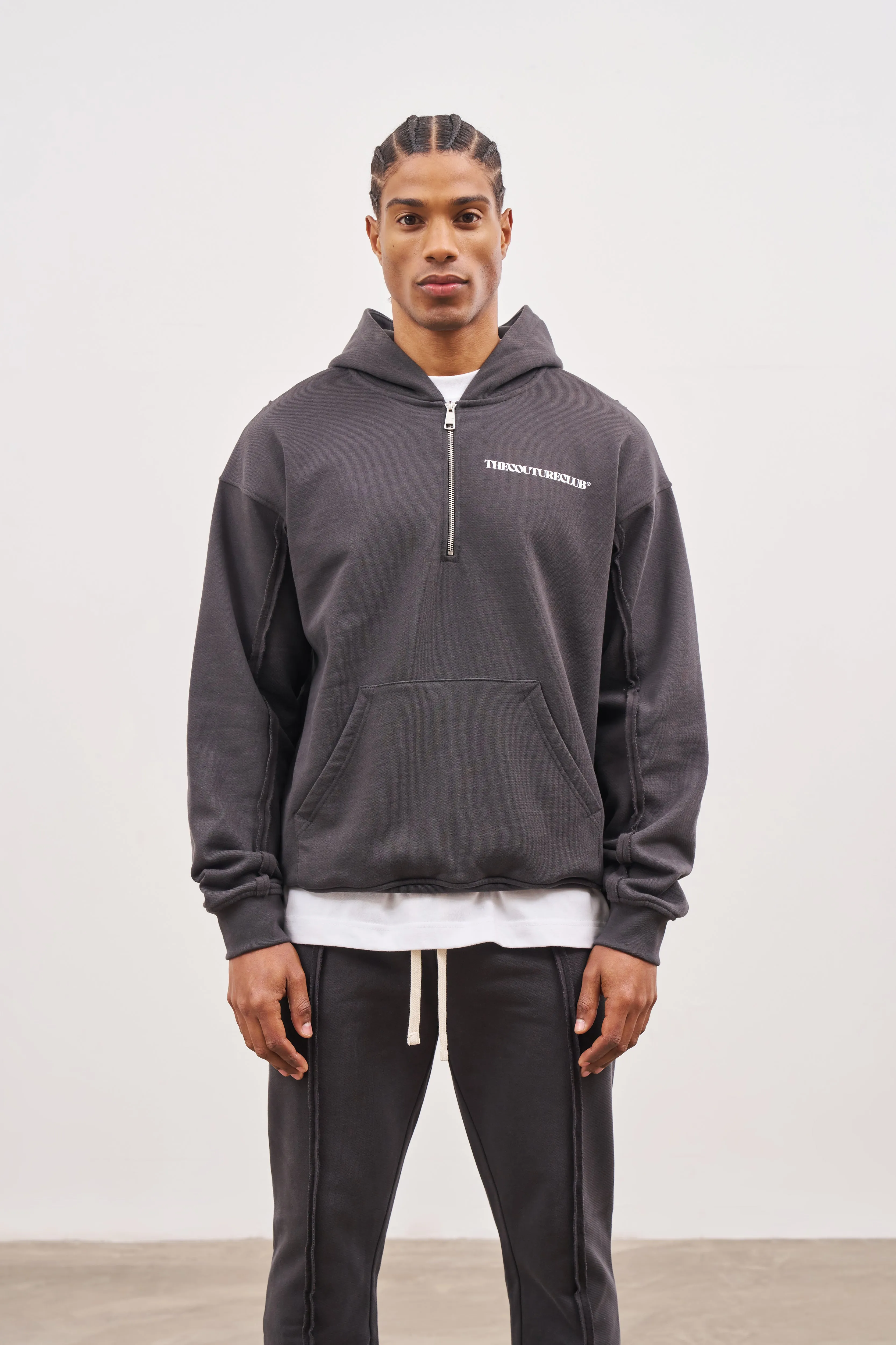 RAW SEAM QUARTER ZIP HOODIE - CHARCOAL